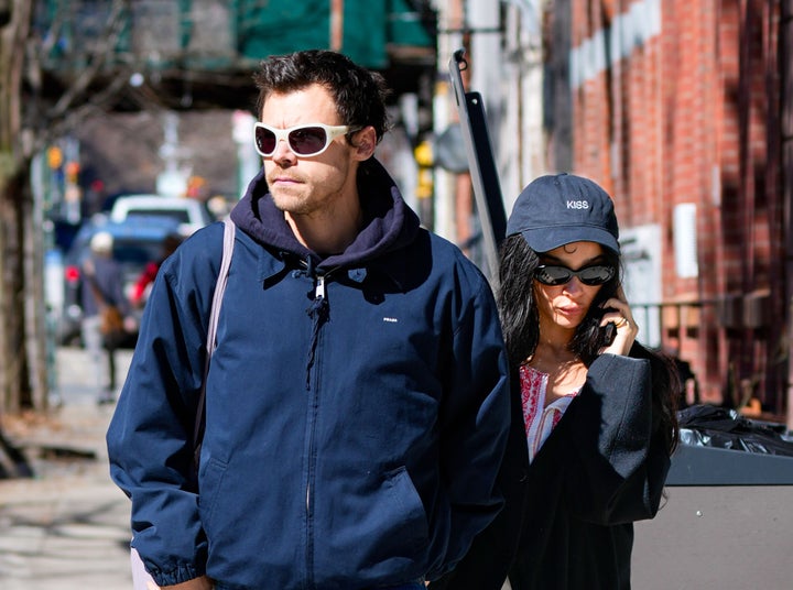 Above, Harry Styles and Zoe Kravitz are seen walking in New York City. Some fans think "taxi cab theory" might be why the pair reportedly got engaged after less than a year of dating — but therapists are more skeptical.