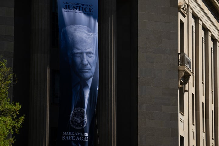 A banner depicting President Donald Trump at the Department of Justice on Tuesday, April 7, 2026. 