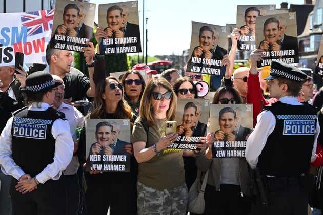 Protestors demonstrate with placards critical of Prime Minister Keir Starmer, outside the Hatzola Northwest Emergency Response Service in Golder Green, following a stabbing attack on two Jewish men in the area, on April 30, 2026
