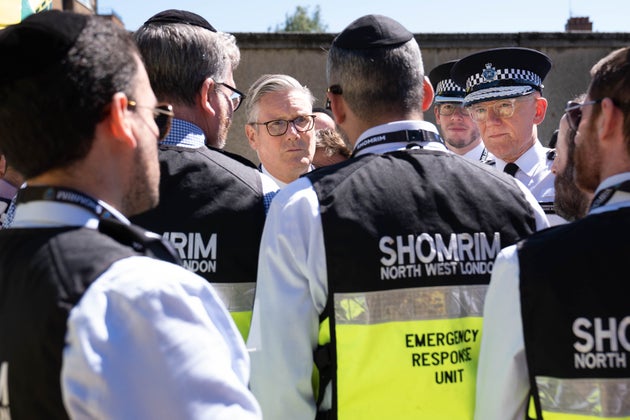 Keir Starmer and Sir Mark Rowley, right, meet first responders from Shomrim North West London during a visit to Golders Green.