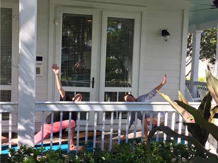 The author and Jenny on one of their "sister" vacations to Key West in 2015, attempting to do yoga.