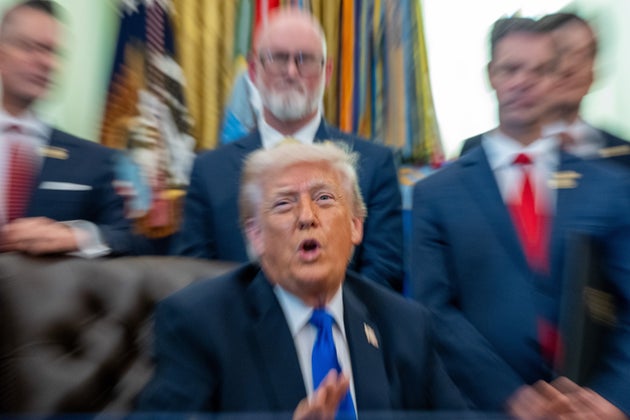 In this image taken with a slow shutter speed, President Donald Trump speaks in the Oval Office of the White House, Thursday, April 30, 2026, in Washington.