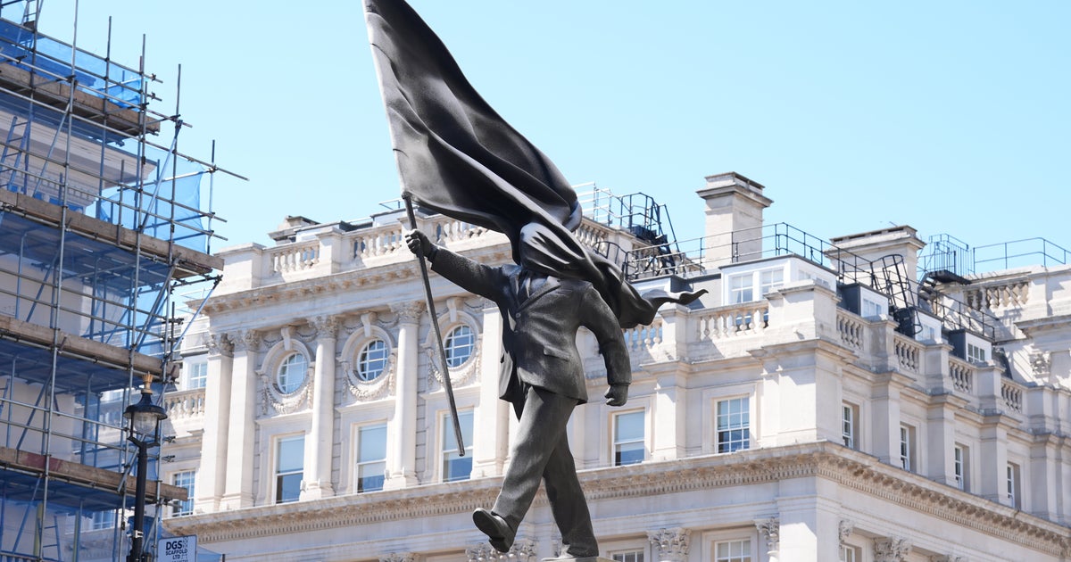 Banksy Stuns With Massive ‘Blind Patriotism’ Statue Stunt In Central London