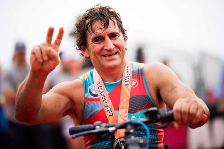 Former Formula 1 driver and paracyclist Alex Zanardi poses after finishing IRONMAN Barcelona on September 30, 2017 in Calella, Barcelona province, Spain. (Photo by Alex Caparros/Getty Images for IRONMAN)