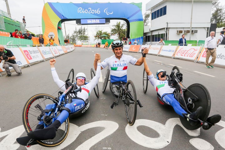 Rio 2016 Paralympic Games Vittorio Podestà of Italy, Alex Zanardi and Luca Mazzone celebrate after winning the men's team relay. (Photo by Mauro Ujetto/NurPhoto via Getty Images)