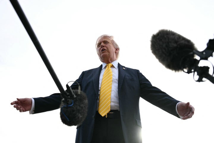US President Donald Trump speaks with reporters at Palm Beach International Airport in West Palm Beach, Florida on May 2, 2026, before boarding Air Force One en route to Miami. (Photo by Jim WATSON / AFP via Getty Images)