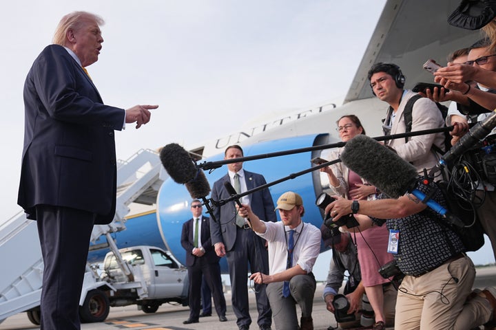President Donald Trump talks to reporters before he boards Air Force One at Palm Beach International Airport in West Palm Beach, Fla., Saturday May 2, 2026, en route Miami. (AP Photo/Matt Rourke)