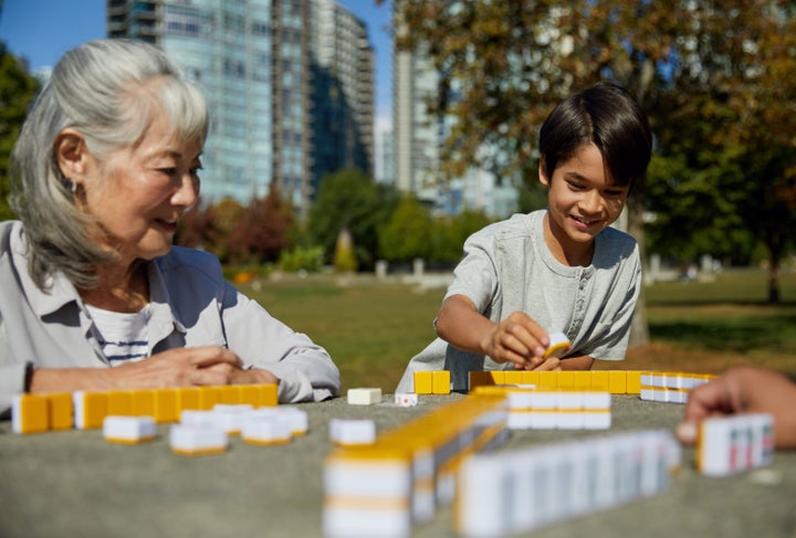 Playing mahjong with family can foster strong intergenerational bonds. 