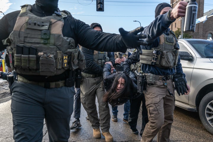 Federal law enforcement agents detain a motorist from a vehicle during a raid in Minneapolis, Minnesota on Tuesday, Jan. 13, 2026. (Victor J. Blue/Bloomberg via Getty Images)