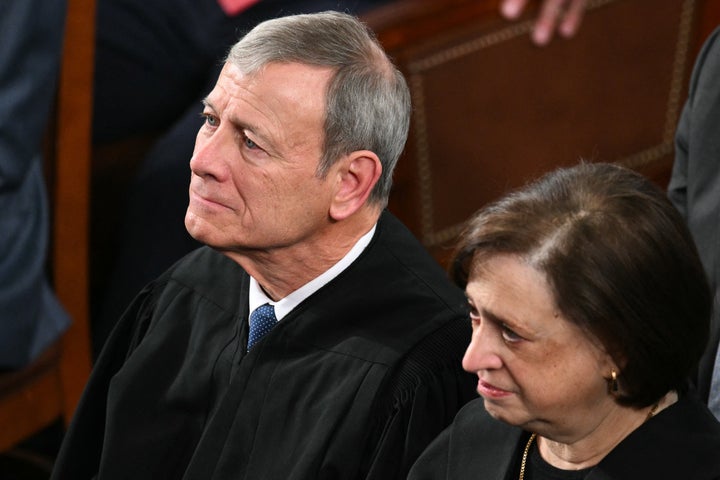 (L/R) Supreme Court Chief Justice John Roberts and Supreme Court Justice Elena Kagan listen as US President Donald Trump delivers the State of the Union address in the House Chamber of the US Capitol in Washington, DC, on February 24, 2026. (Photo by Mandel NGAN / AFP via Getty Images)
