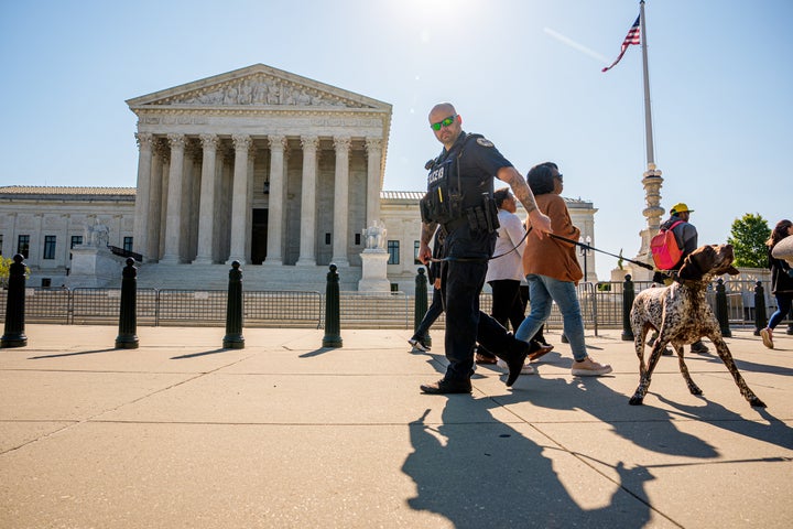 WASHINGTON, DC - MAY 4: A K9 officer patrols in front of the U.S. Supreme Court building on May 4, 2026 in Washington, DC. The Supreme Court will usually release opinions on Monday mornings during the months of May and June. (Photo by Andrew Harnik/Getty Images)