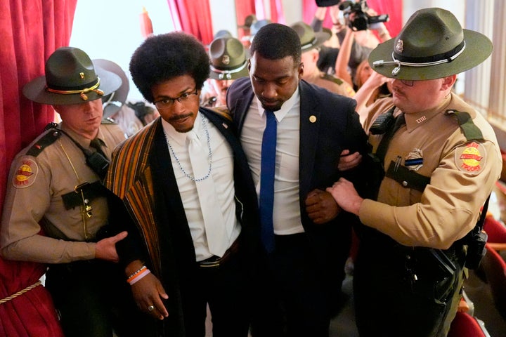 Rep. Justin J. Pearson, D-Memphis, second from left, walks with his brother KeShaun Pearson, as he is arrested and removed from the House gallery during a special session of the state legislature to redraw U.S. Congressional voting maps Thursday, May 7, 2026, in Nashville, Tenn. (AP Photo/George Walker IV)