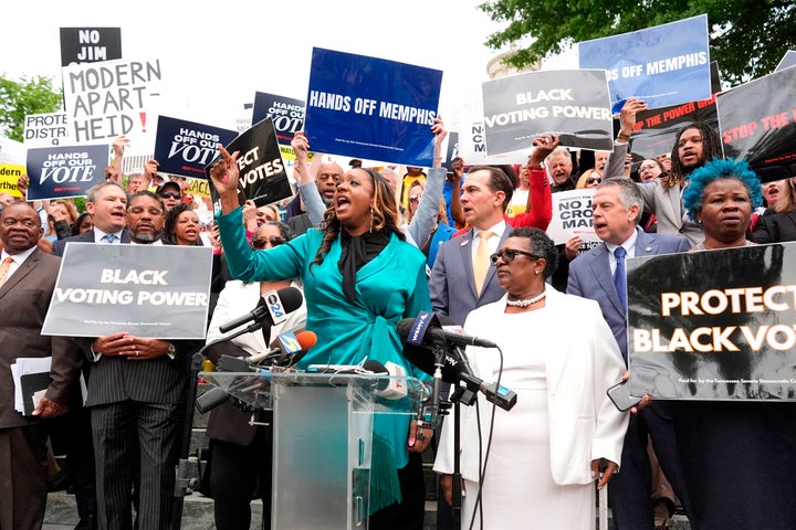Sen. London Lamar (D-Memphis), center, speaks during a news conference before a special session of the state legislature to redraw U.S. Congressional voting maps.