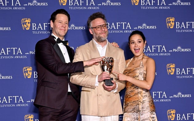 Ike Barinholtz, Seth Rogen and Chase Sui Wonders celebrate The Studio's win at the TV Baftas