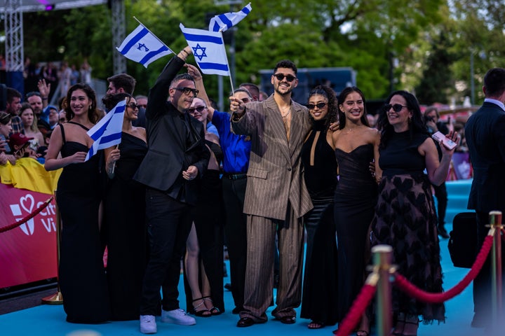 Noam Bettan posing with members of the Israeli delegation during this year's Eurovision opening ceremony