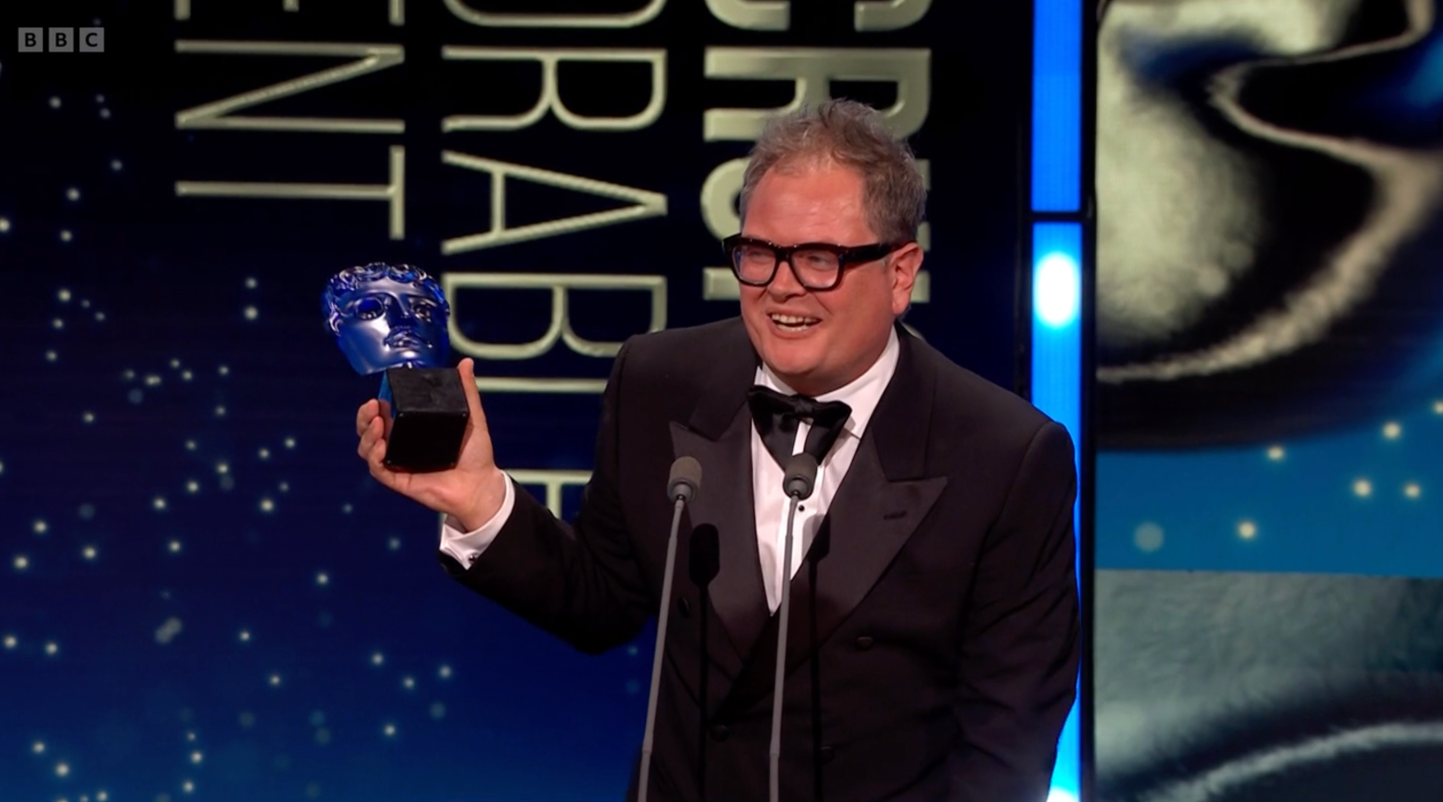 Alan Carr Shouts Out 'Thick' Celebrity Traitors Co-Stars After Winning A TV Bafta