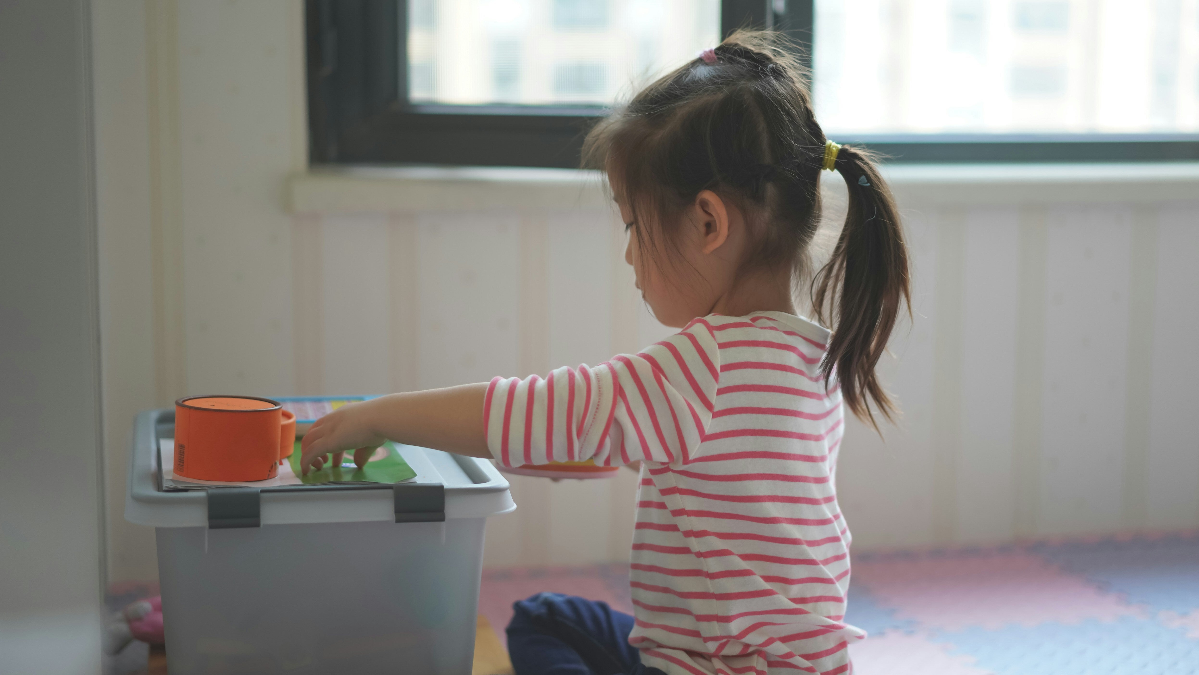 A Study Just Unearthed How To *Really* Get Your Toddler To Help Tidy Up
