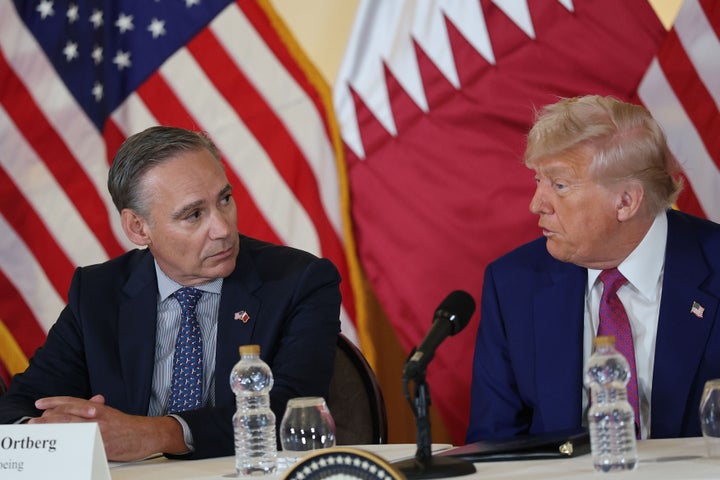 U.S. President Donald J. Trump speaks to CEO of Boeing Kelly Ortberg as he meets with business leaders at the Ritz Carlton Hotel on May 15, 2025, in Doha, Qatar. (Photo by Win McNamee/Getty Images)