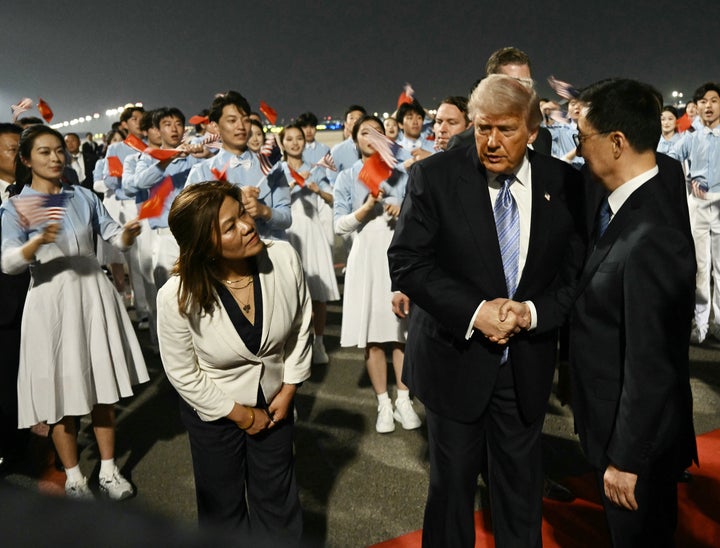 President Donald Trump is greeted by China's Vice President Han Zheng upon arriving at Beijing Capital Airport in Beijing on May 13, 2026. (Photo by Brendan SMIALOWSKI / AFP via Getty Images)