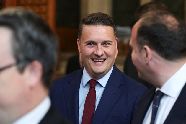 British Health Secretary Wes Streeting walks through the House of Commons to attend the State Opening of Parliament at the Palace of Westminster, London, Wednesday, May 13, 2026. (Toby Melville/Pool Photo via AP)