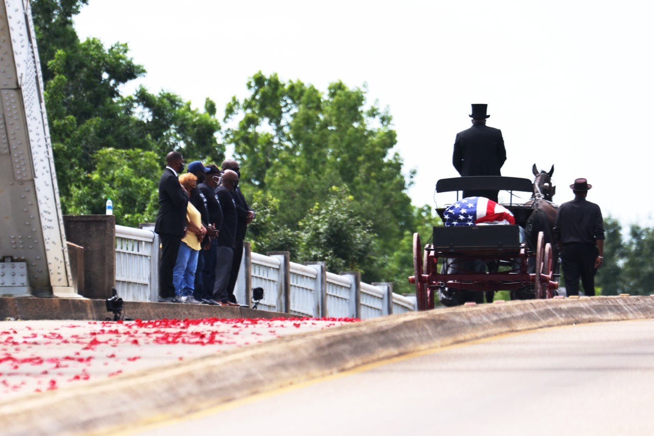 A horse drawn carriage carrying the body of civil rights icon, former US Rep. John Lewis (D-Ga.) crosses the Edmund Pettus Bridge in Selma, Ala. where he was beaten during the 1965 march that spurred the passage of the Voting Rights Act.