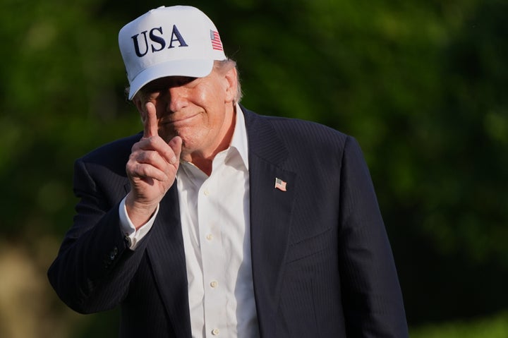 President Donald Trump gestures to reporters as he walks across the South Lawn of the White House, Friday, May 15, 2026, in Washington, on return from Beijing where he met with China's President Xi Jinping. (AP Photo/Jacquelyn Martin)