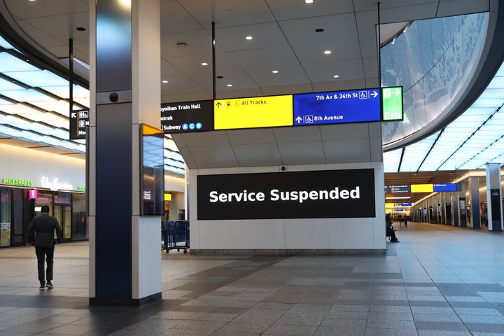 Service suspended signs are posted inside Penn Station on the first day of a Long Island Rail Road strike, Saturday, May 16, 2026, in New York. (AP Photo/Heather Khalifa)