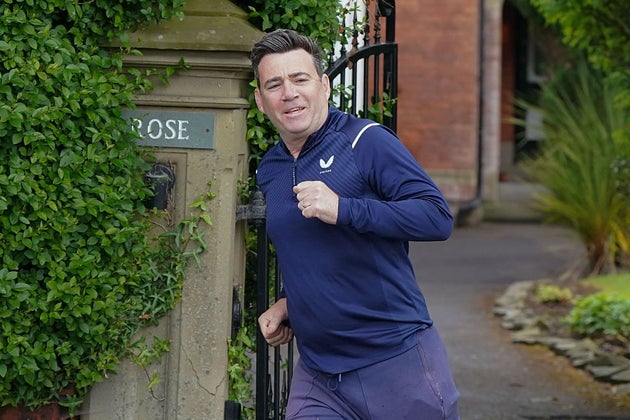 Greater Manchester mayor Andy Burnham goes for run near his home this morning.