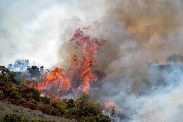 By mid-afternoon, the Sandy Fire had consumed more than 500 acres of dry brush and damaged at least one home.