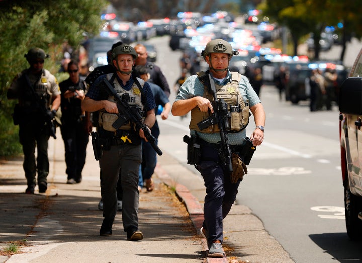 San Diego, CA - May 18: Law enforcement officers escort people away from the Islamic Center of San Diego after a shooting on May 18, 2026 in San Diego, CA. (Photo by K.C. Alfred / The San Diego Union-Tribune via Getty Images)