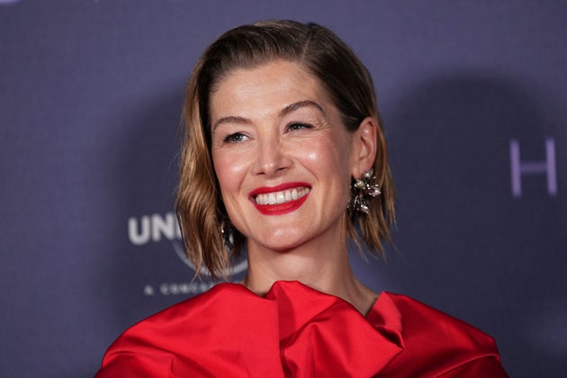 Rosamund Pike poses for photographers upon arrival at the screening of the film 'Hallow Road' on Monday, April 28, 2025, in London. (Photo by Scott A Garfitt/Invision/AP)