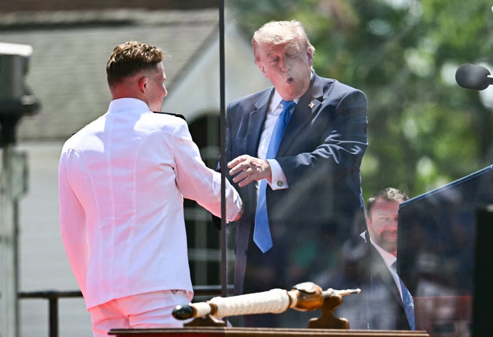 President Donald Trump greets a cadet after delivering the commencement address to the United States Coast Guard Academy on Wednesday.