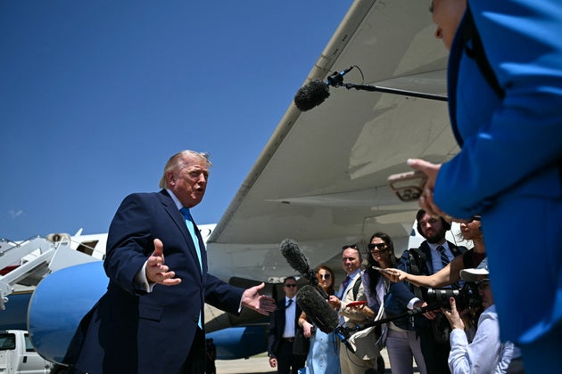 US President Donald Trump speaks to reporters after stepping off Air Force One at Joint Base Andrews, Maryland on May 20, 2026