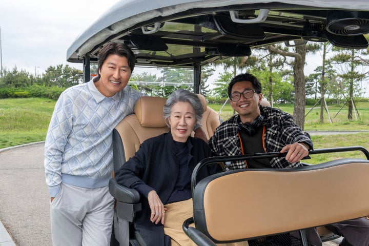 Song Kang-ho as Dr. Kim, Youn Yuh-jung as Chairwoman Park and executive producer/writer Lee Sung Jin filming Season 2 of "Beef."
