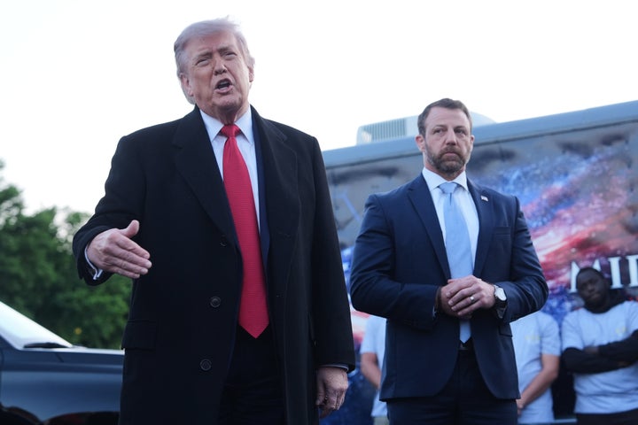 President Donald Trump speaks as he visits the Lincoln Memorial Reflecting Pool to see the new blue protective coating being applied as part of a renovation project, Thursday, May 7, 2026, in Washington, as Homeland Security Secretary Markwayne Mullin listens. (AP Photo/Mark Schiefelbein)