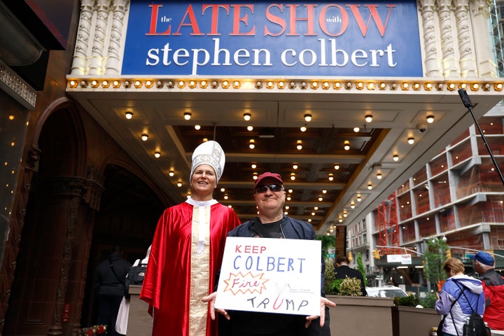 A person holds up a sign following Thursday's taping of the final episode of "The Late Show" after 32 years on air at the Ed Sullivan Theater.