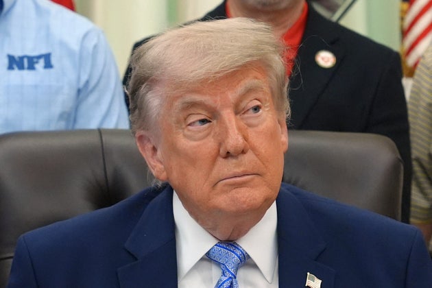 President Donald Trump attends an event about loosening a federal refrigerant rule, in the Oval Office at the White House, Thursday, May 21, 2026, in Washington. 