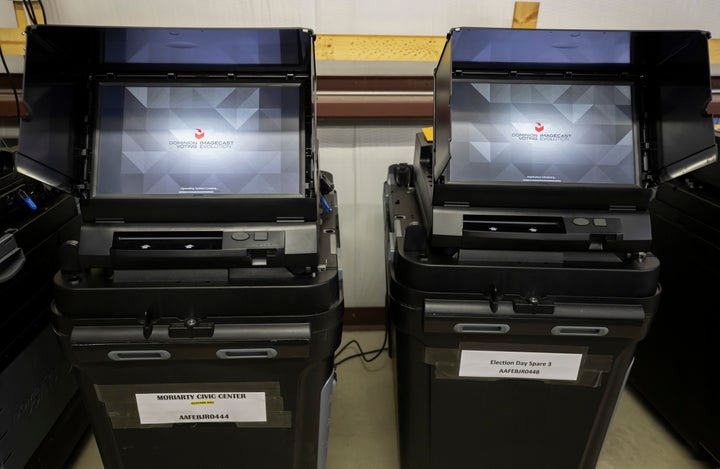 FILE - Dominion Voting ballot-counting machines are shown at a Torrance County warehouse during election equipment testing with local candidates and partisan officers in Estancia, N.M., Sept. 29, 2022. (AP Photo/Andres Leighton, File)