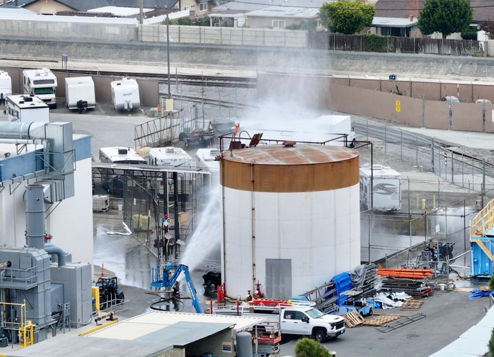 Water is sprayed on a tank that overheated at an aerospace plant in Garden Grove, Calif., Friday, May 22, 2026. (Jeff Gritchen/The Orange County Register via AP)