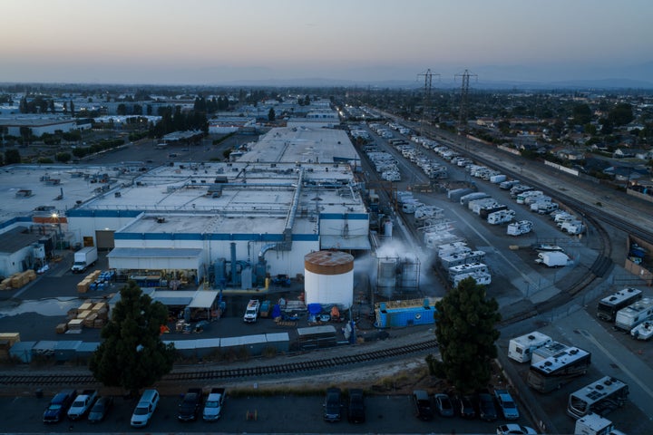 Water is sprayed on a tank that overheated at an aerospace plant in Garden Grove, Calif., Friday, May 22, 2026. (AP Photo/Ethan Swope)