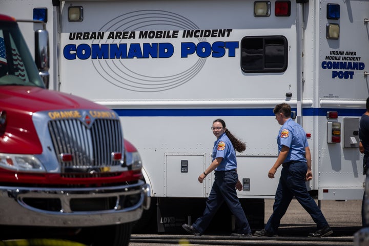 Emergency personnel work at the incident command post at the Los Alamitos Race Course Sunday, May 24, 2026, in Cypress, Calif. (AP Photo/Ethan Swope)