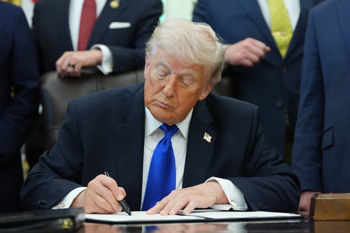President Donald Trump signs an executive order in the Oval Office of the White House, Thursday, April 30, 2026, in Washington. (AP Photo/Alex Brandon)