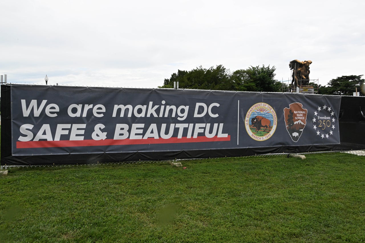 A large sign shows preparations for Freedom 250 events.