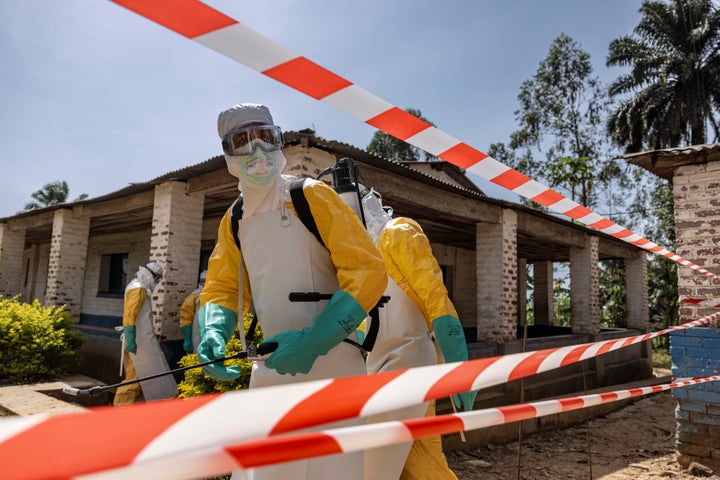 A member of the Médecins Sans Frontières (MSF) Ebola response team disinfects a restricted area outside Mongbwalu General Referral Hospital during outbreak preparedness and infection prevention activities in Kongbwalu, Democratic Republic of Congo, on 26 May 2026. (Photo: Michel Lunanga/Getty Images)