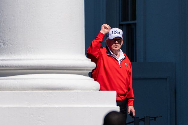 President Donald Trump pumps his fist as he arrives at the White House, Sunday, May 31, 2026, in Washington.