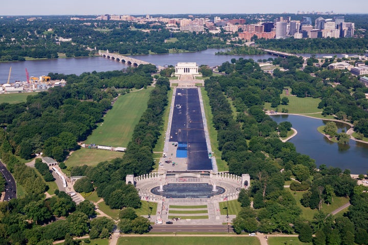 Construction work continues to seal the bottom of the pool on the National Mall on Friday in Washington, D.C.