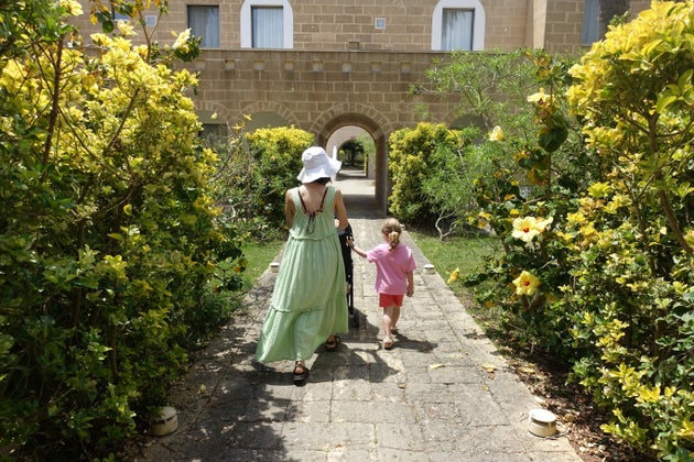 Tasha and her daughter at Vivosa Apulia Resort, heading to their hotel room.