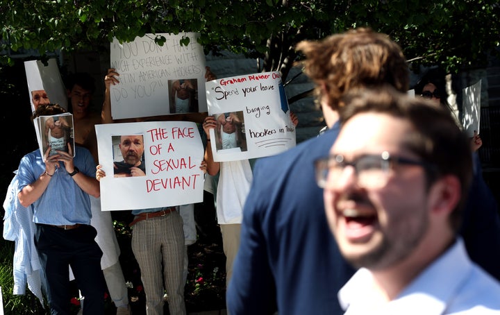 Demonstrators protest outside the Democratic Senatorial Campaign Committee as Senate candidate for Maine Graham Platner meets with Democrats in Washington on June 2, 2026. The oyster farmer and combat veteran is once again facing controversy after multiple ex-girlfriends told The New York Times about volatile behavior during their relationship that sometimes including demeaning women, cheating and heavy drinking.