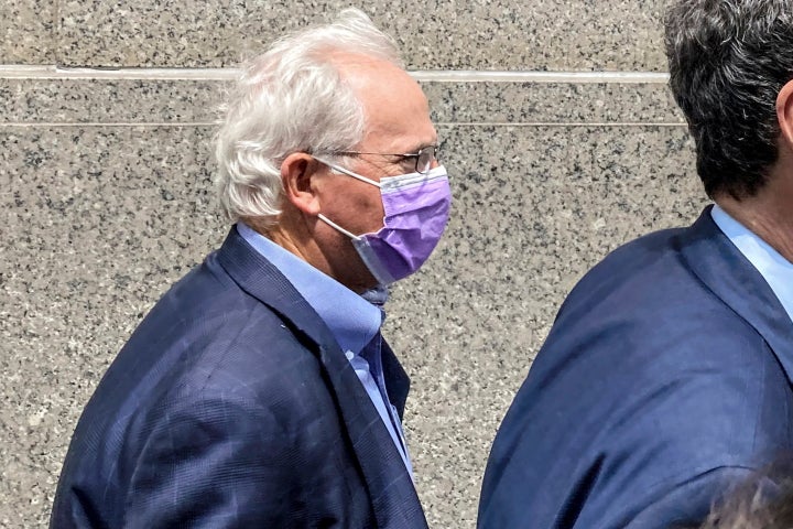 FILE — Former U.S. Rep. Stephen Buyer, left, trails his lawyer as he leaves Manhattan federal court after pleading not guilty to charges that he participated in an insider trading scheme while working as a consultant, July 27, 2022, in New York. (AP Photo/Larry Neumeister, File)