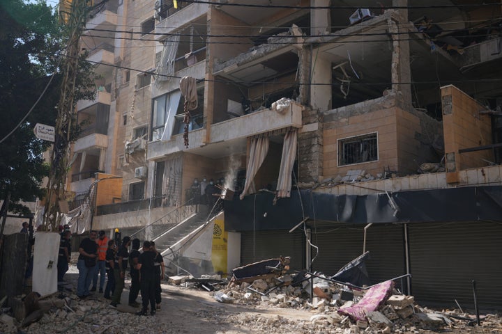 Lebanese security officers gather at the site where an Israeli airstrike hit a building in Dahiyeh, Beirut's southern suburb, Lebanon, on June 7, 2026.